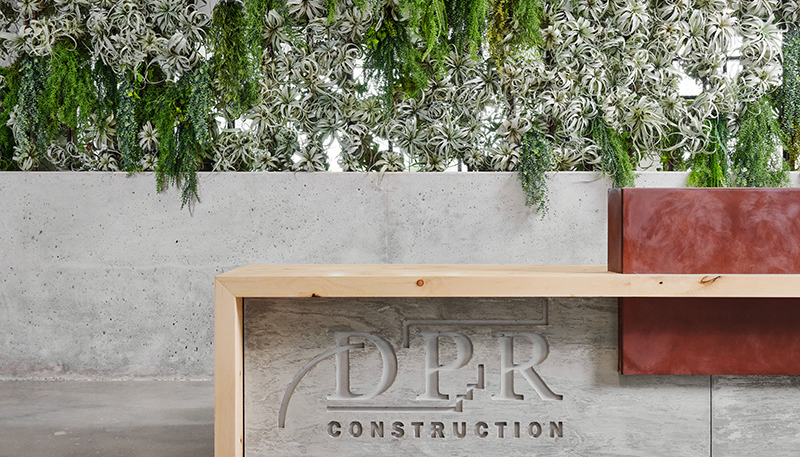 Earth Day 2020: Data that Counts in the Built Environment Living wall behind a DPR sign in the Austin office.