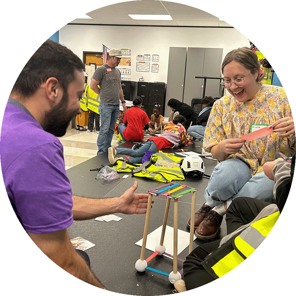 People assembling a tower in a classroom
